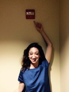 Ariana Seigel poses with a fire alarm, after winning the Grand Prize for most original choreography.  Image:  Kris Eitland