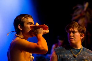 Ben Ellerbrock (right) encourages Jonah Gercke to assert his leadership by blowing the conch