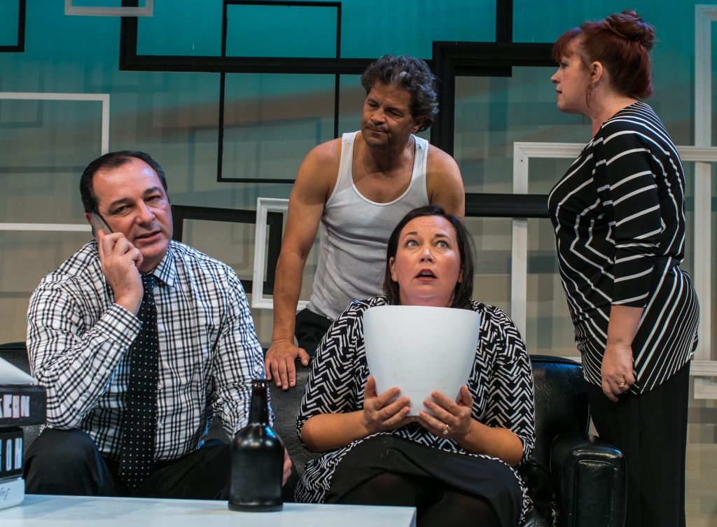If looks could kill: Alan Raleigh, Michael Novak, Annette Raleigh and Veronica Novak (from left, Manny Fernandes, Jeffrey Keith Jones, Kristianne Kurner and Melissa Fernandes) are fixin' to rumble in New Village Arts' 'God of Carnage'. Photo by Shaun Hagen. 